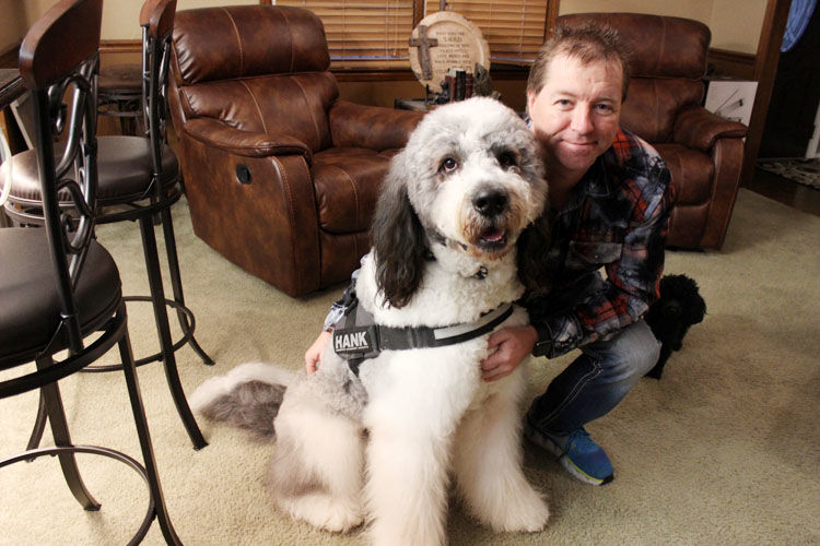 Emotional Support Dog Hank and his owner Shawn Roberts. (image by: By Katie Murawski, YesWeekly)