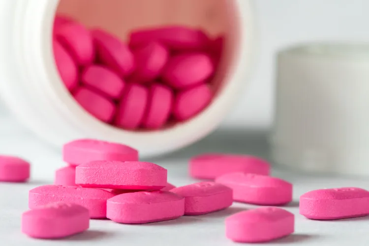 Pink Benadryl pills that might be used for dogs